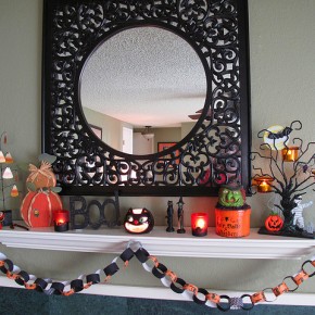 50 Awesome Halloween Decorating Ideas White Fireplace With Glass and Cute Pumpkins