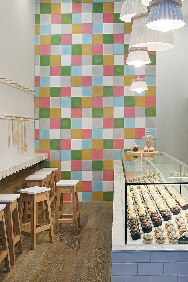 Interior Design for a Cupcake Shop with full color wallpaper and wall table