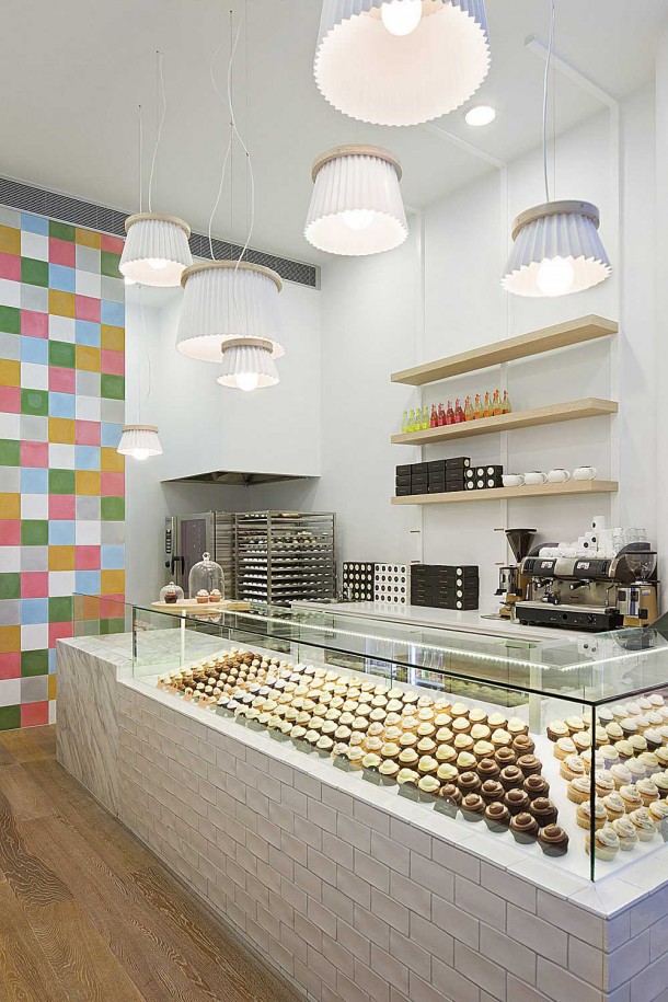 Interior Design for a Cupcake Shop with glass cookies table